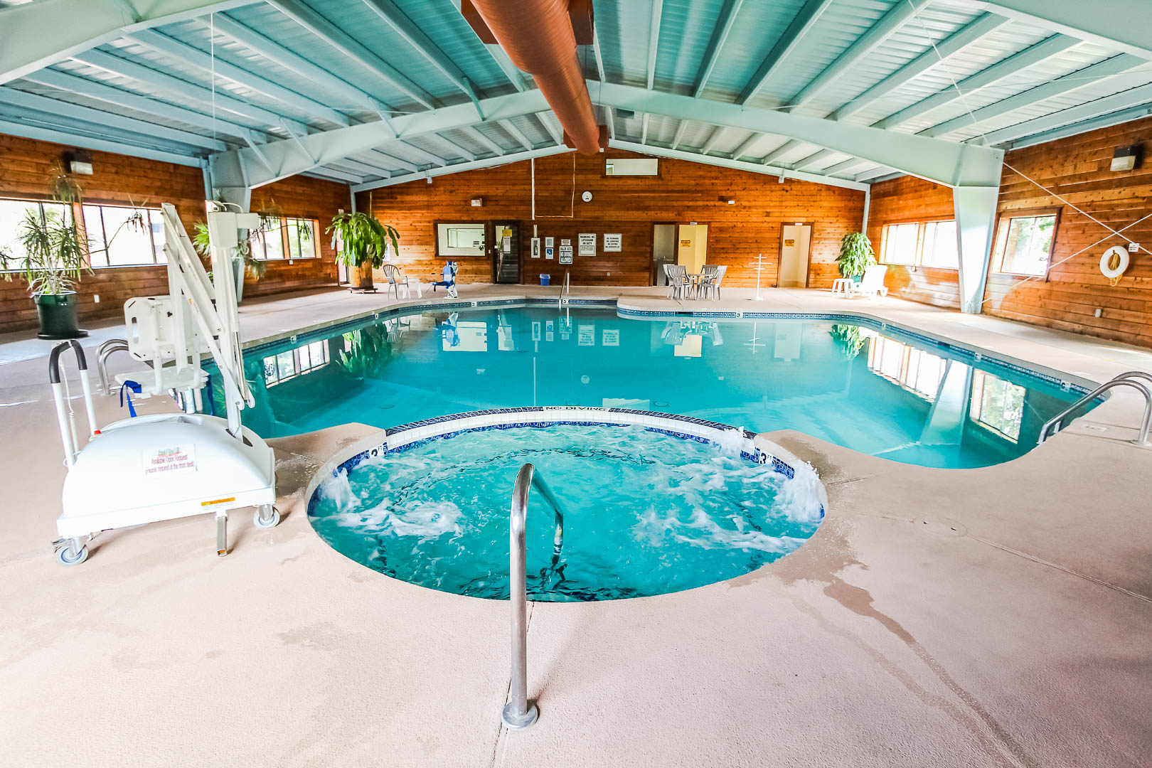 A spacious indoor swimming pool and Jacuzzi at VRI's Roundhouse Resort in Pinetop, Arizona.